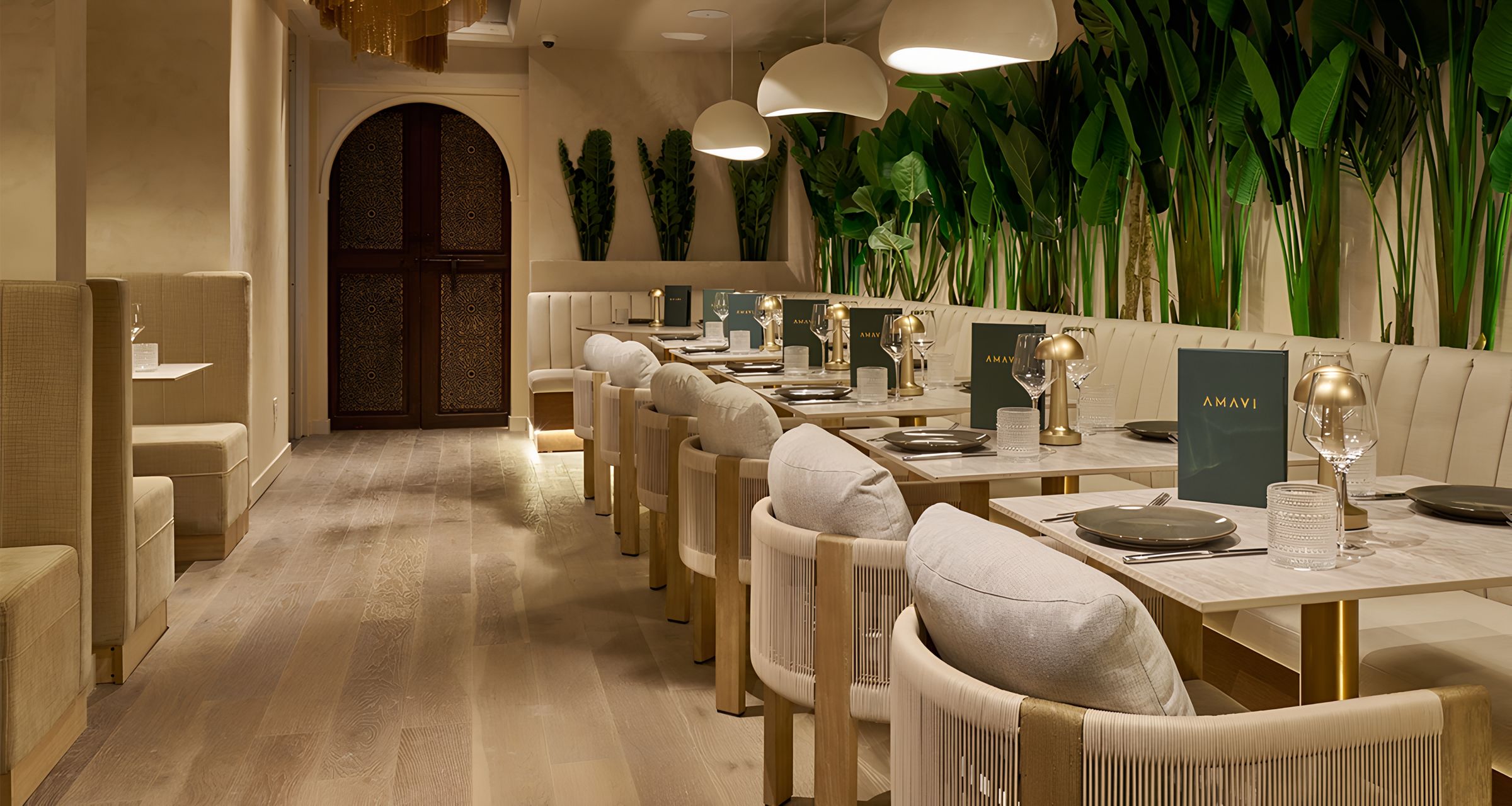 marble-top dining tables with tropical plant backdrop