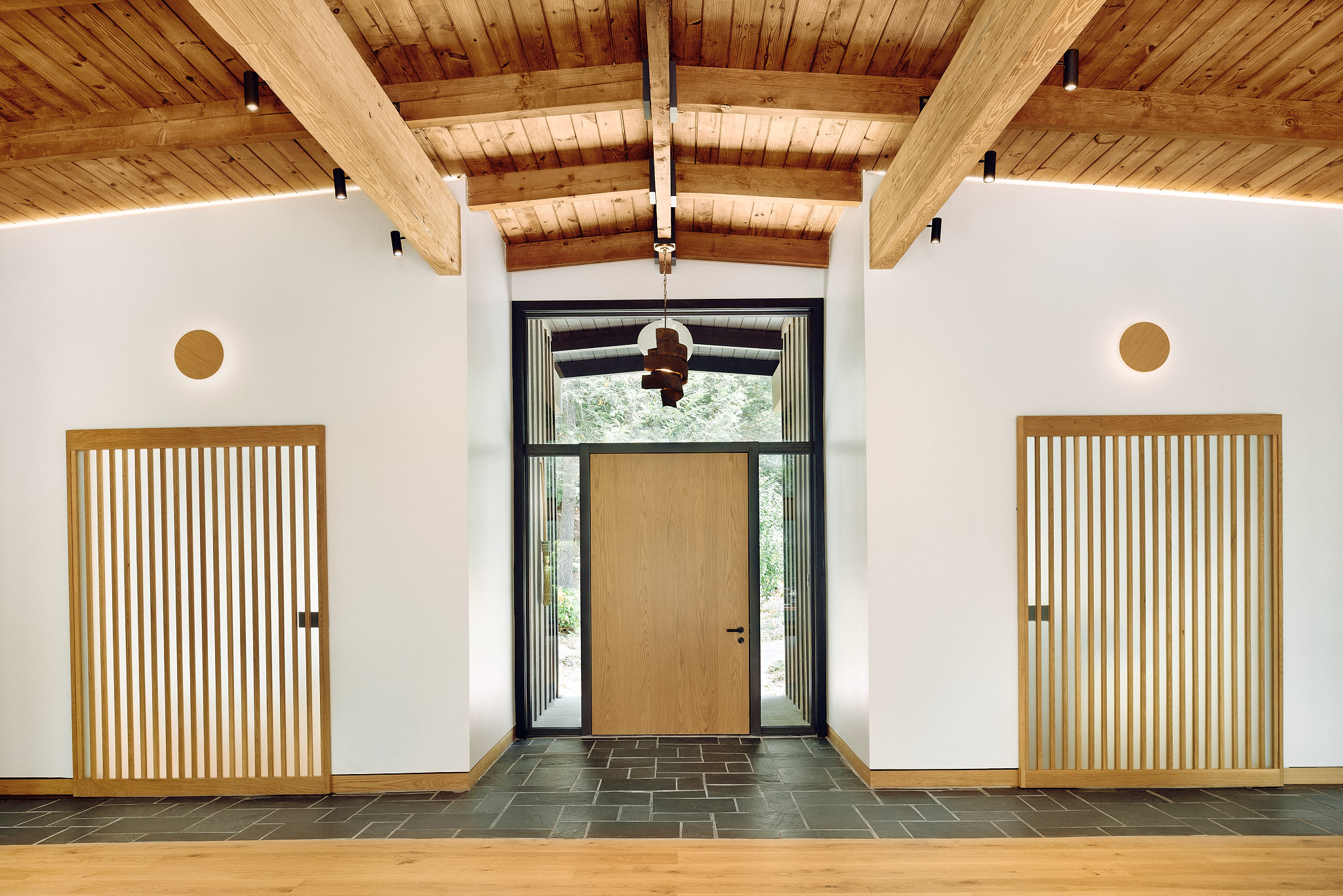 main entryway with wood doors