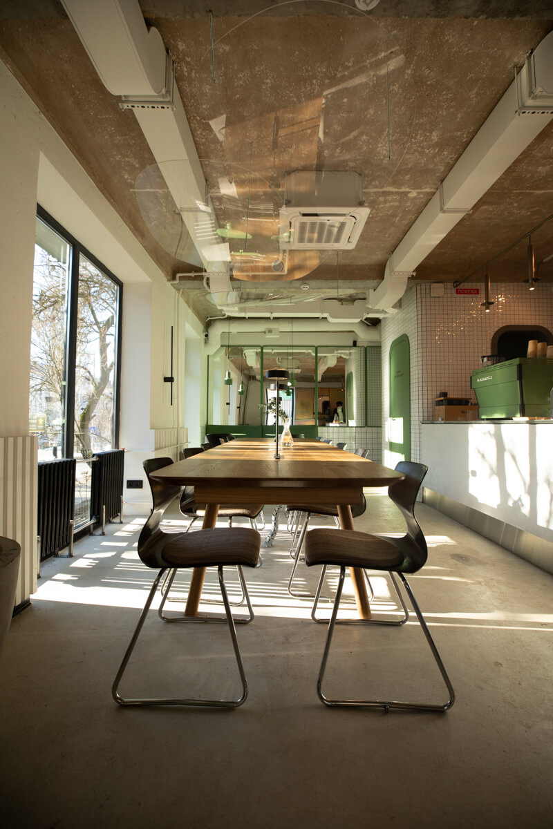 long perspective of main seating hall toward bar