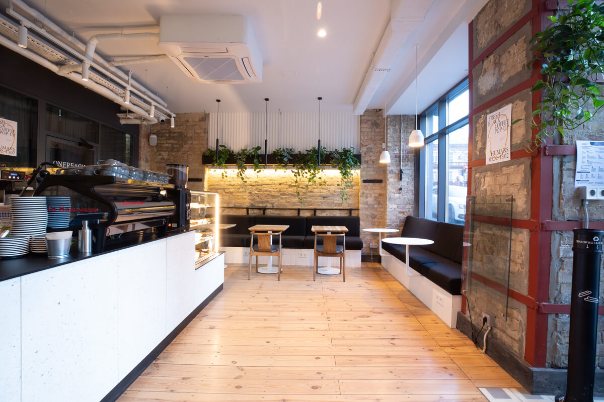 bar counter with la marzocco machine and lounge seating