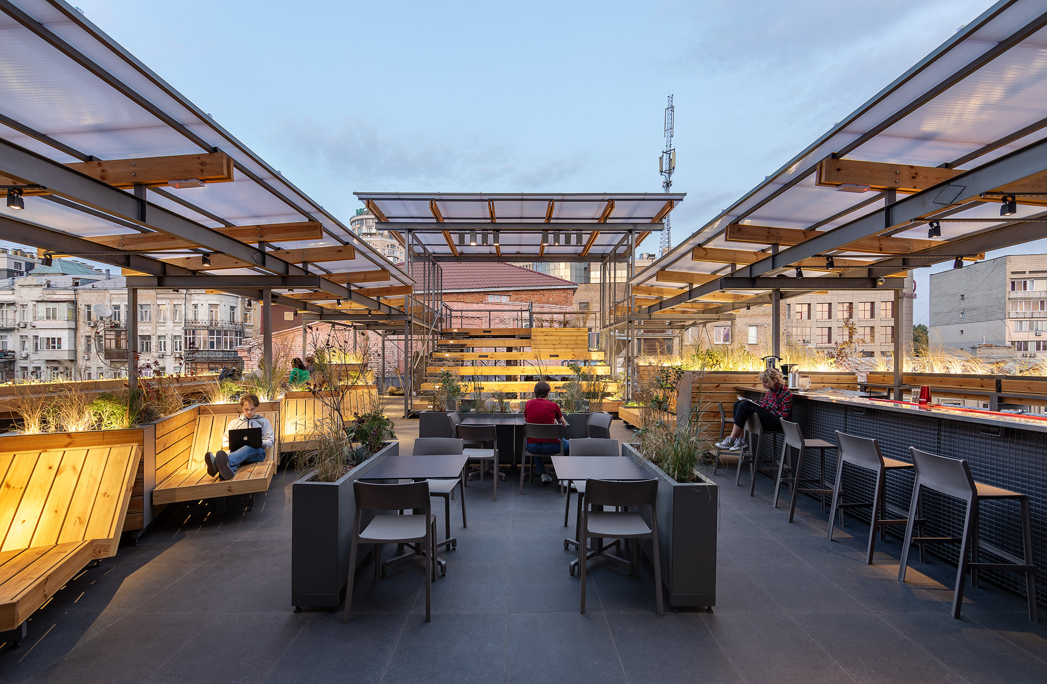 rooftop terrace seating under translucent roof panels